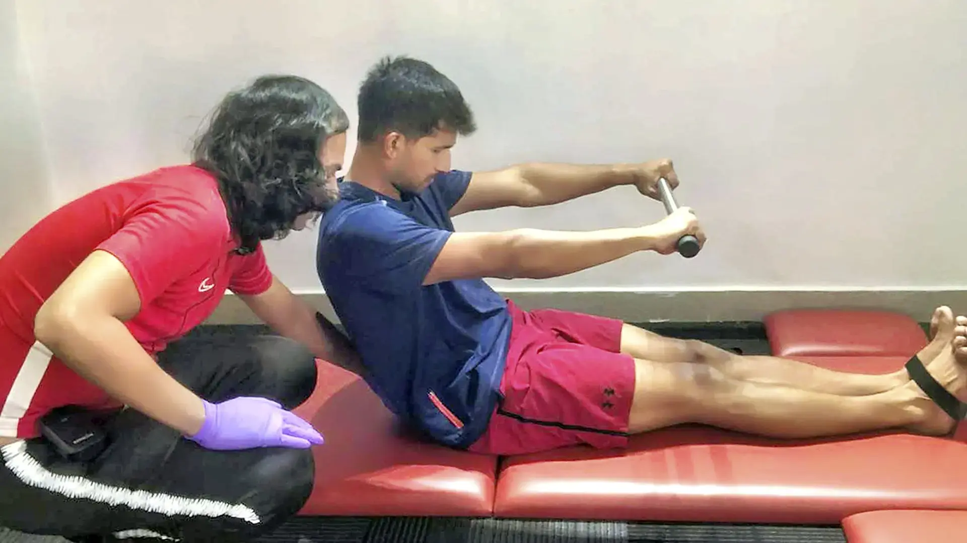 Beginner learning controlled movement during Pilates lesson