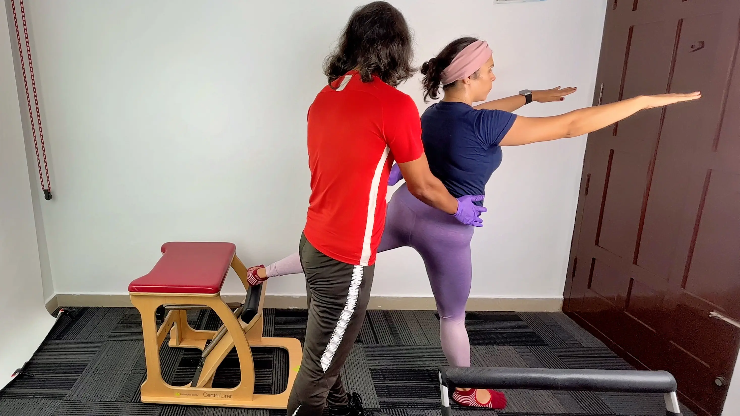 Pilates instructor working closely with a client at a private studio in Bengaluru