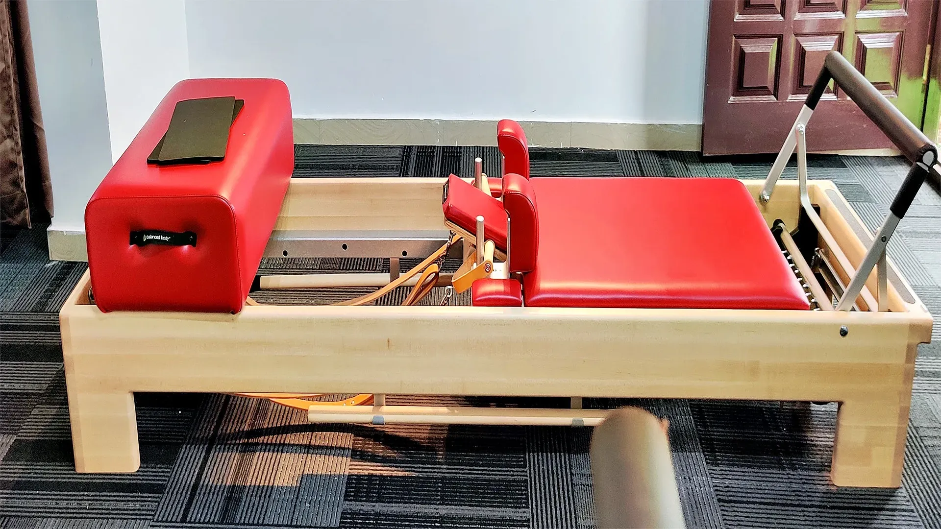 Traditional Pilates apparatus including Cadillac and Reformer at a private studio in Bengaluru