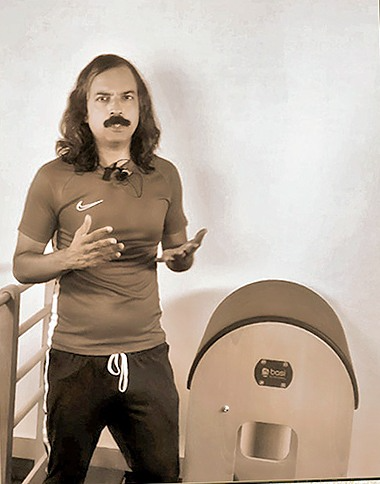 Abdul Kalam beside the Ladder Barrel at his private Pilates studio in Bengaluru